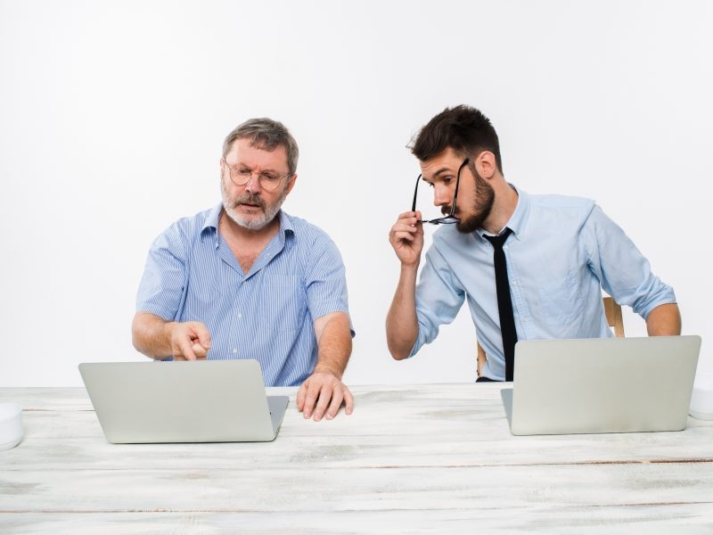 The Two Colleagues Working Together At Office